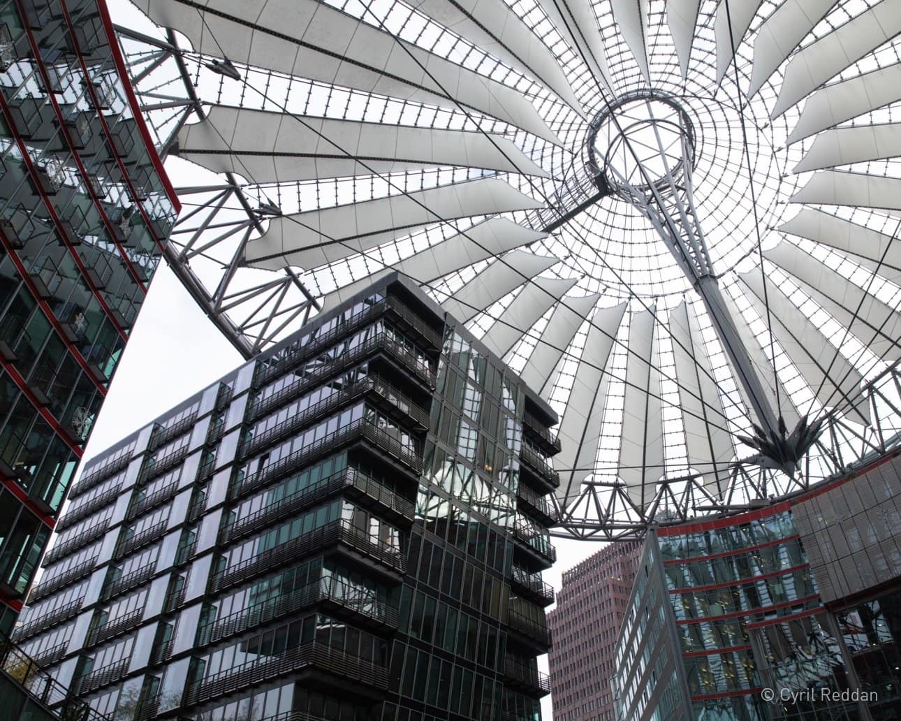 Looking up at a highly engineered vast roof structure