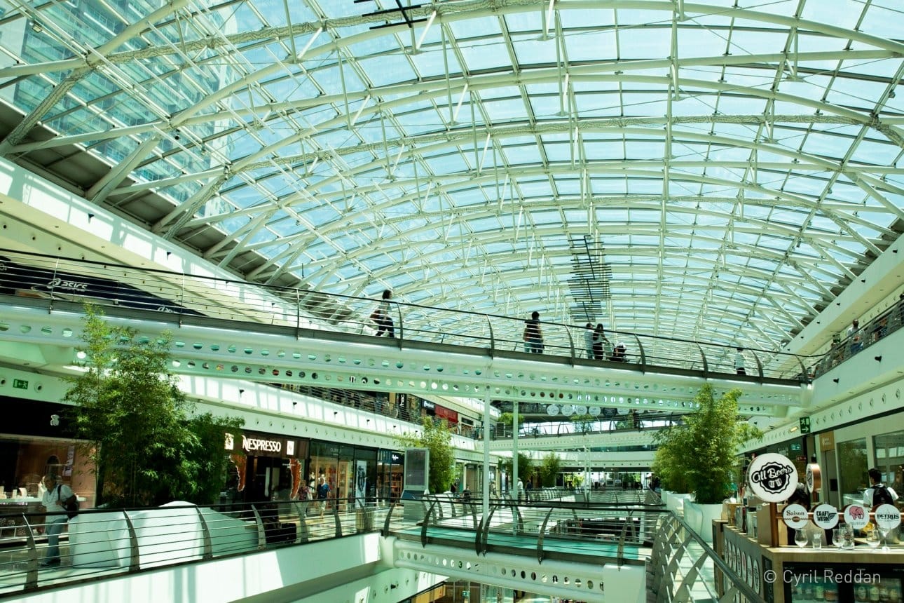 Interior photograph of the Vasco Da Gama Shopping Centre with escalators