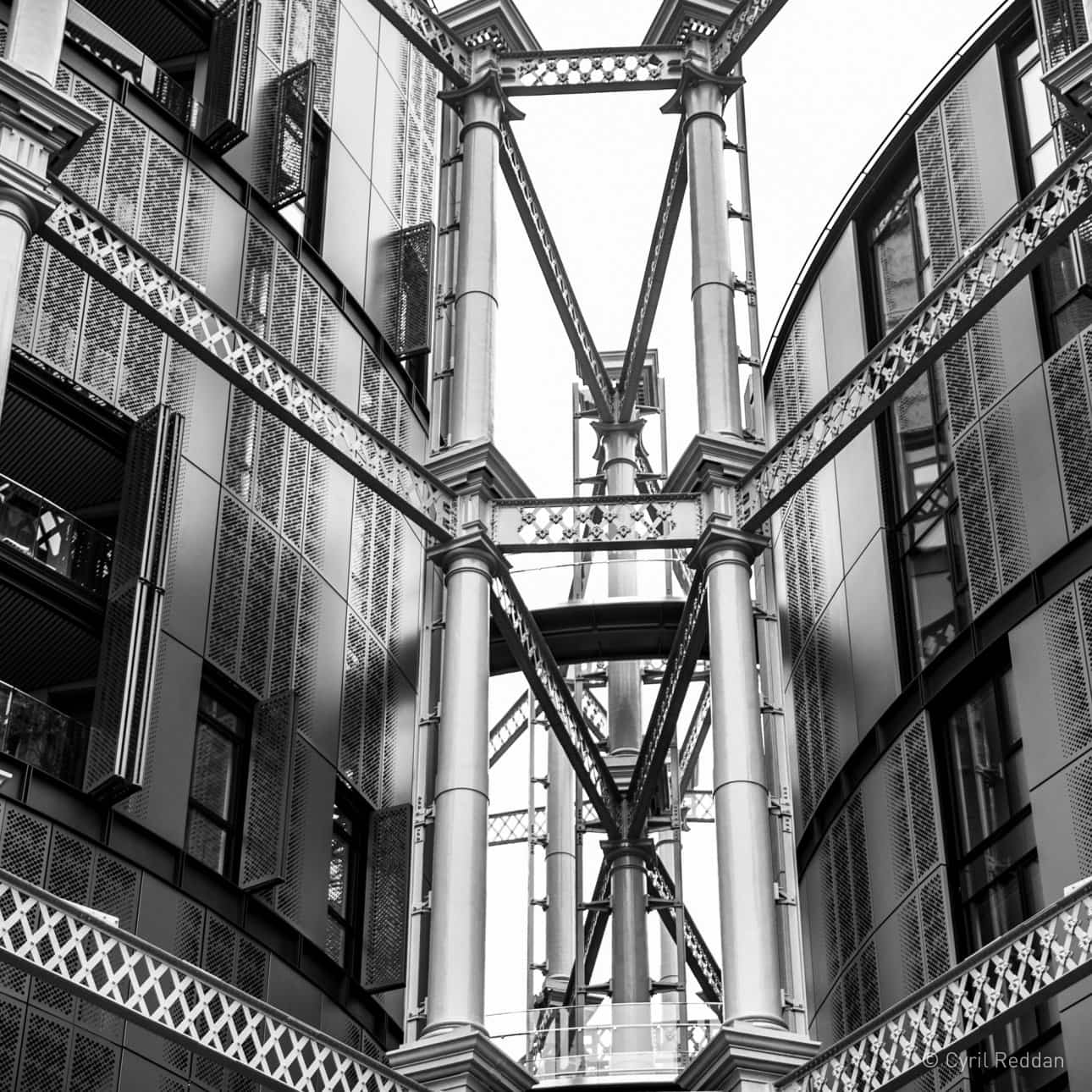 Black and white photo of the structure of the Kings Cross Gasometers