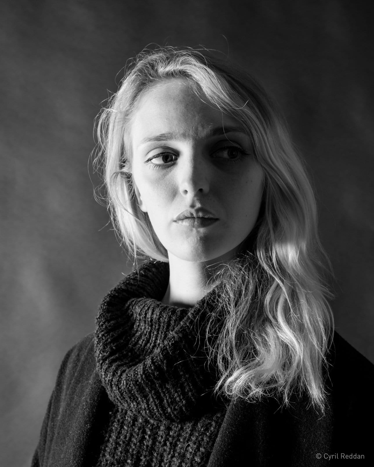 Black and white portrait of a woman in an office